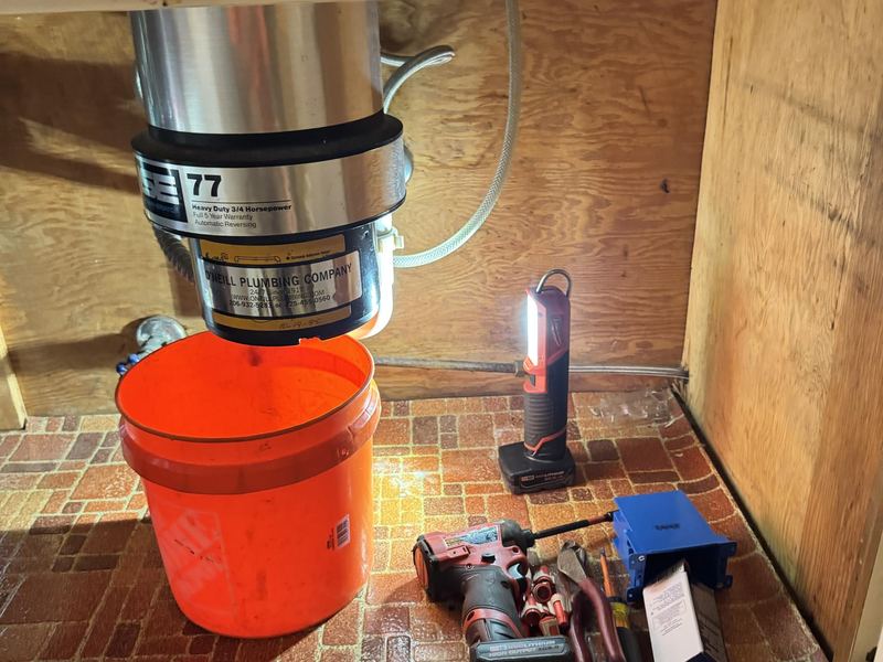Reverse osmosis system installed under a kitchen sink on Mercer Island