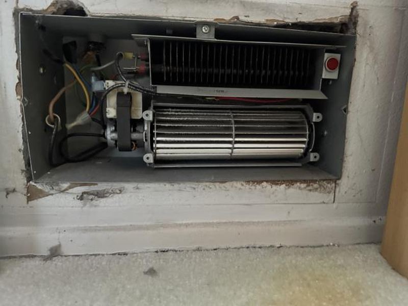 New electric wall heater being installed in a Redmond home