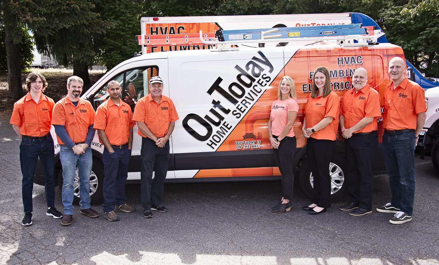 The OutToday team standing in front of a branded OutToday service van